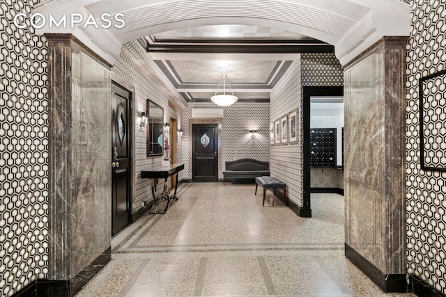 hallway featuring ornamental molding