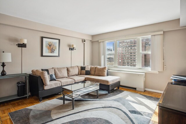 333 E 66th St Unit 11J, New York City, NY 10021 - living room featuring baseboards