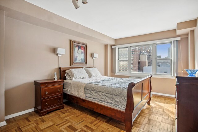 333 E 66th St Unit 11J, New York City, NY 10021 - bedroom featuring baseboards
