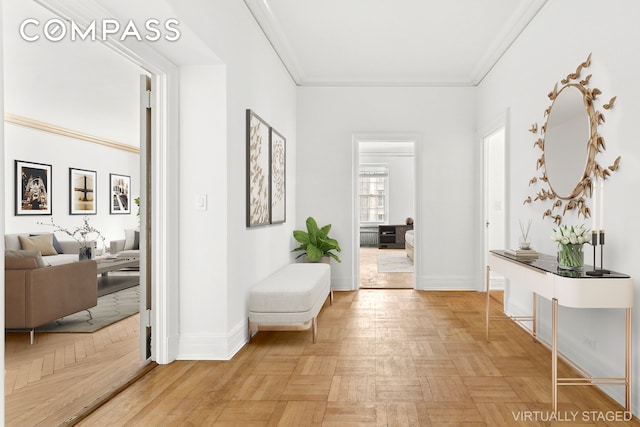 living room featuring crown molding, a fireplace, and baseboards