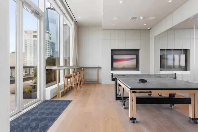 rec room with visible vents and light wood-style floors
