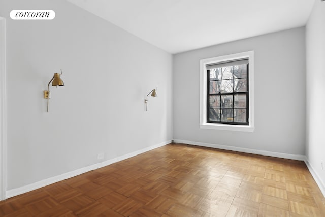 empty room featuring parquet flooring