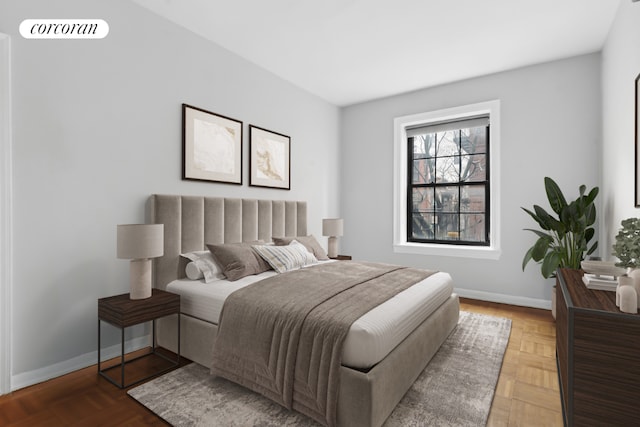 bedroom featuring parquet flooring