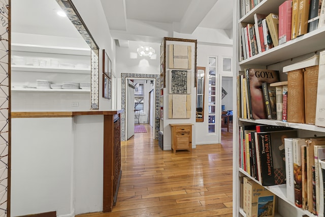100 Hudson St Unit 4A, New York City, NY 10013 - hallway featuring wood-type flooring and a chandelier
