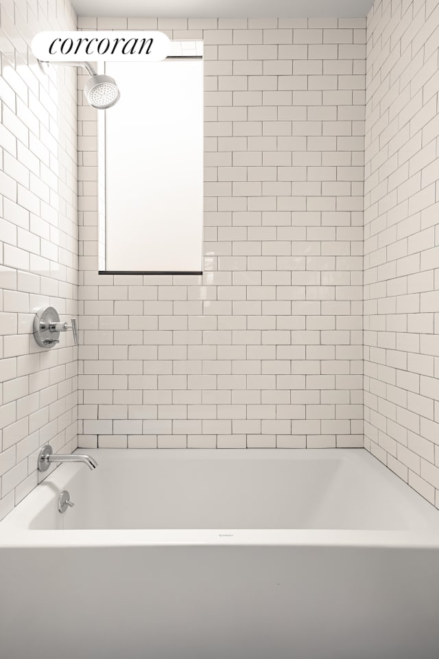 bathroom with shower / tub combination