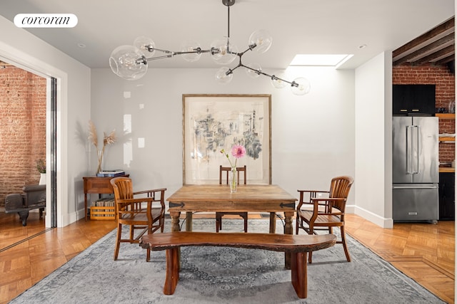 dining room with brick wall, a skylight, visible vents, and baseboards