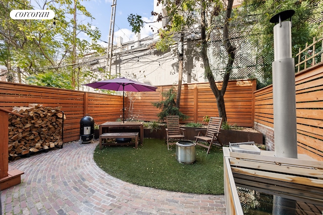 115 Milton St, New York City, NY 11222 - view of patio with a fenced backyard
