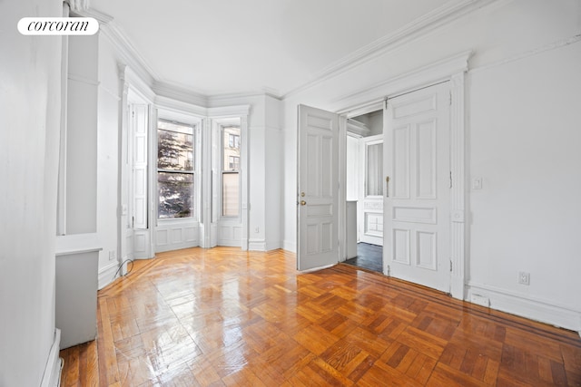 unfurnished bedroom featuring crown molding