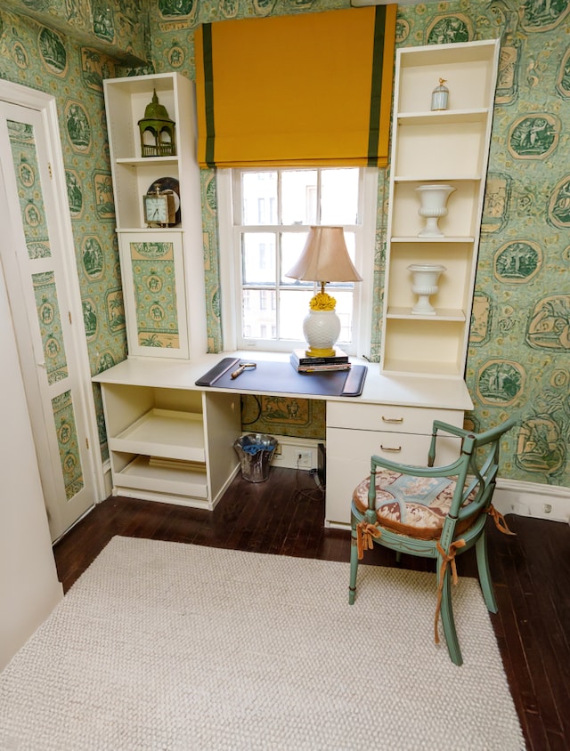 71 E 77th St Unit 9C, New York City, NY 10075 - living area featuring dark wood finished floors, wallpapered walls, a desk, and baseboards