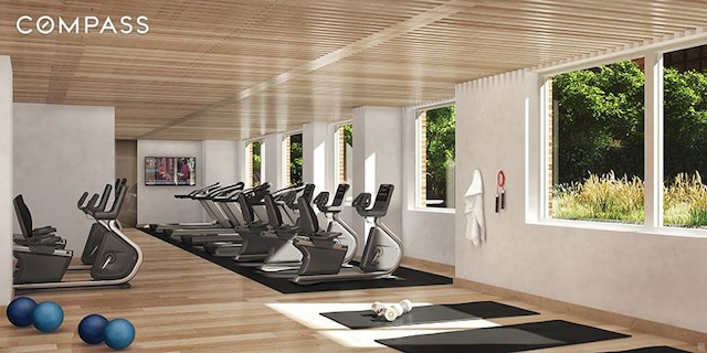 gym with wood finished floors and wood ceiling