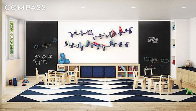 playroom featuring wood finished floors and recessed lighting