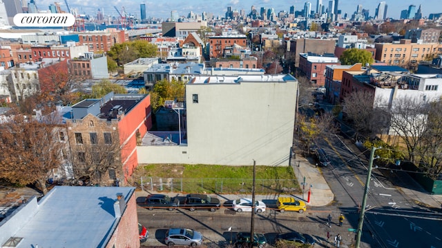 birds eye view of property featuring a view of city