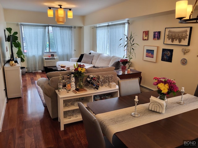 300 W 145th St Unit 1K, New York City, NY 10039 - living area featuring healthy amount of natural light, wood finished floors, a baseboard heating unit, and cooling unit
