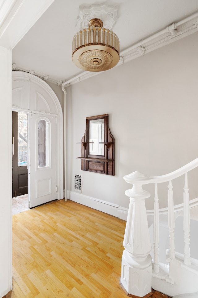 46 Clifton Place, New York City, NY 11238 - foyer entrance featuring light wood finished floors and baseboards