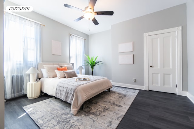 bedroom featuring dark hardwood / wood-style flooring and ceiling fan