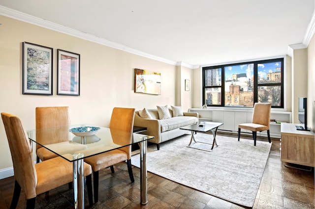 living area featuring ornamental molding and baseboards