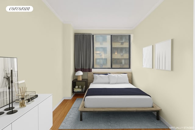 bedroom featuring visible vents, light wood-type flooring, baseboards, and ornamental molding