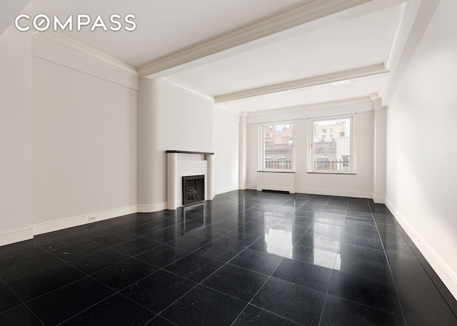 unfurnished living room featuring a fireplace, granite finish floor, ornamental molding, beamed ceiling, and baseboards