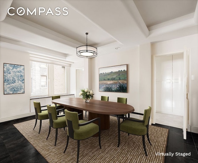 dining room with a tray ceiling