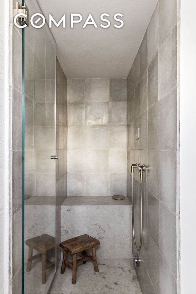 bathroom with tiled shower
