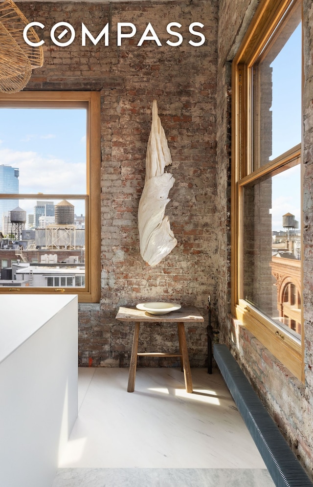 interior space featuring concrete flooring and a city view