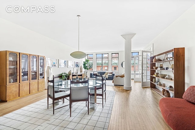 dining space with light hardwood / wood-style flooring