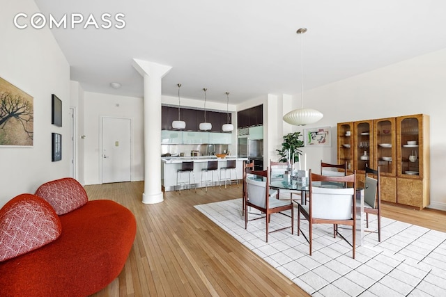 dining space with light wood-type flooring