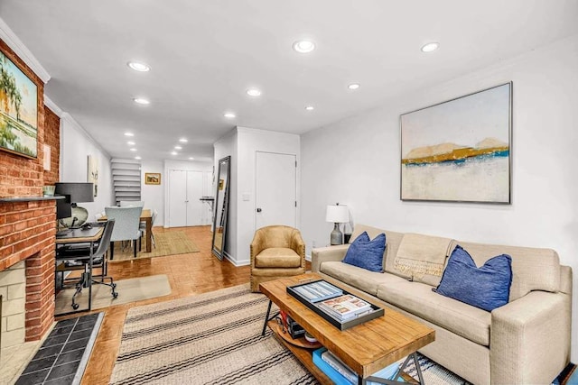 250 W 15th St Unit 1C, New York City, NY 10011 - living room featuring a fireplace, recessed lighting, light wood-style flooring, and baseboards