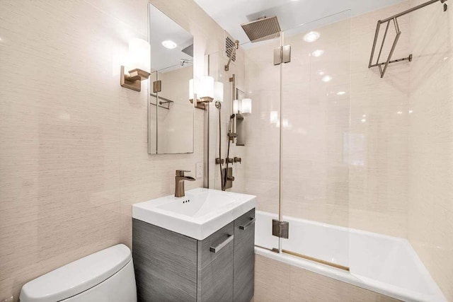 250 W 15th St Unit 1C, New York City, NY 10011 - bathroom featuring a combined bath / shower with rainfall shower, vanity, toilet, and tile walls