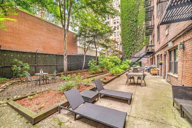 250 W 15th St Unit 1C, New York City, NY 10011 - fenced backyard with outdoor dining space and a patio area