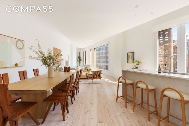 dining area featuring light wood-type flooring