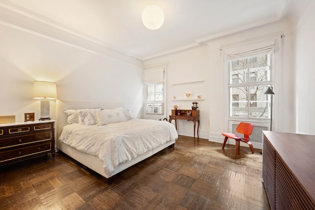 bedroom with ornamental molding and dark parquet floors