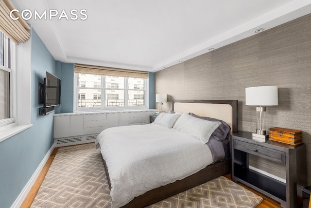 bedroom featuring a baseboard heating unit