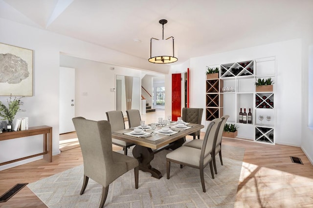 dining area featuring light wood-type flooring