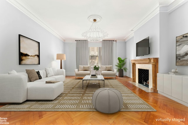 living area with a fireplace, ornamental molding, and a notable chandelier