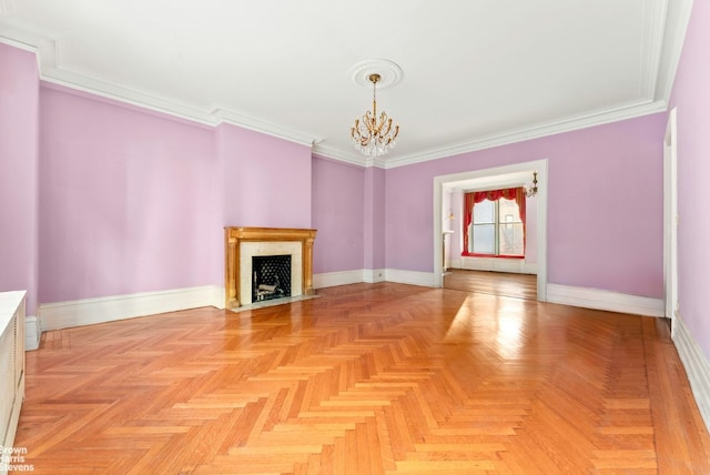 unfurnished living room with an inviting chandelier, a fireplace with flush hearth, baseboards, and crown molding