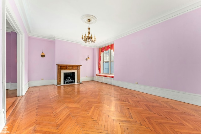 unfurnished living room featuring crown molding, a fireplace, an inviting chandelier, and baseboards