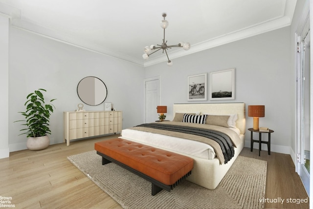 bedroom with an inviting chandelier, wood finished floors, and crown molding