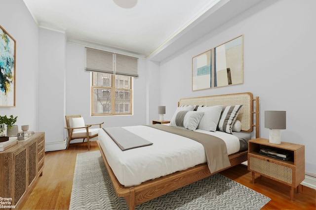 310 W 86th St Unit 3A, New York City, NY 10024 - bedroom featuring crown molding, light wood-style floors, and baseboards