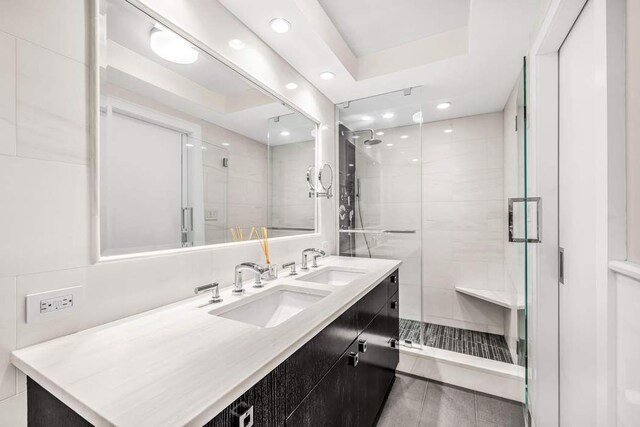 35 Sutton Pl Unit 3C, New York City, NY 10022 - full bath with a stall shower, double vanity, and recessed lighting
