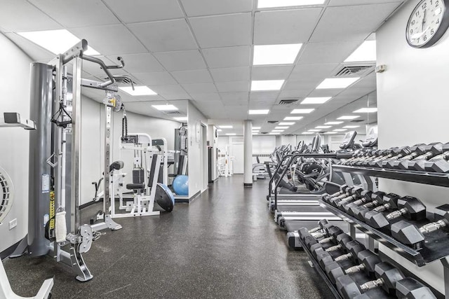 gym featuring a drop ceiling