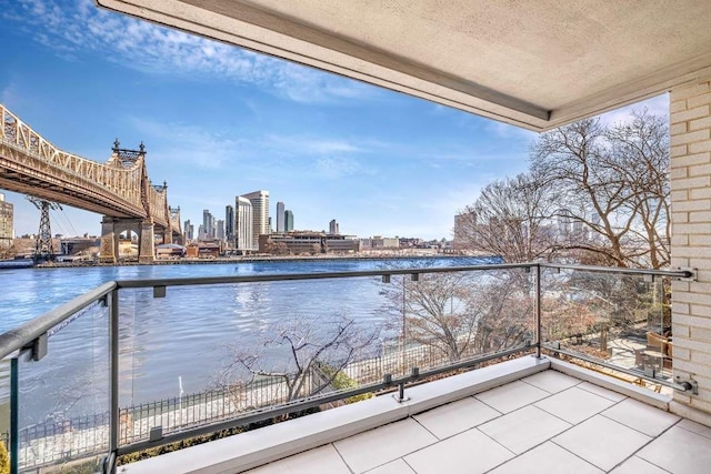 balcony featuring a water view