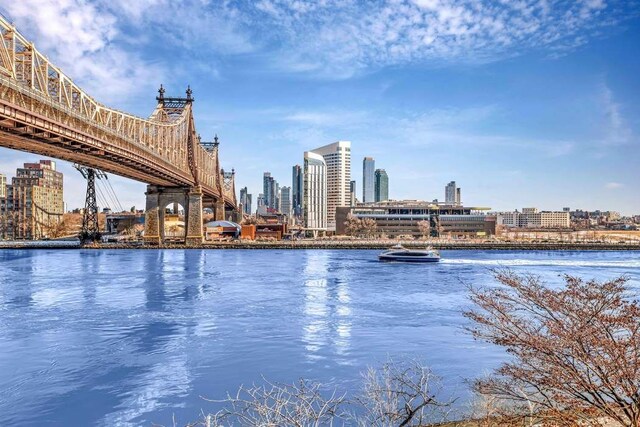 35 Sutton Pl Unit 3C, New York City, NY 10022 - view of swimming pool featuring a view of skyline and a water view