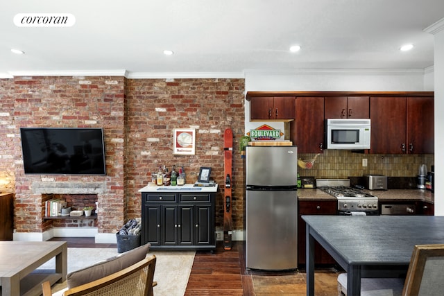 kitchen with stove, crown molding, dark hardwood / wood-style flooring, stainless steel fridge, and dark brown cabinets