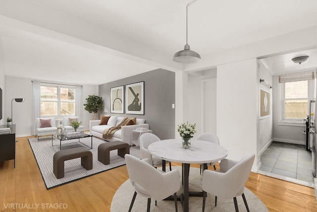 dining area with hardwood / wood-style floors