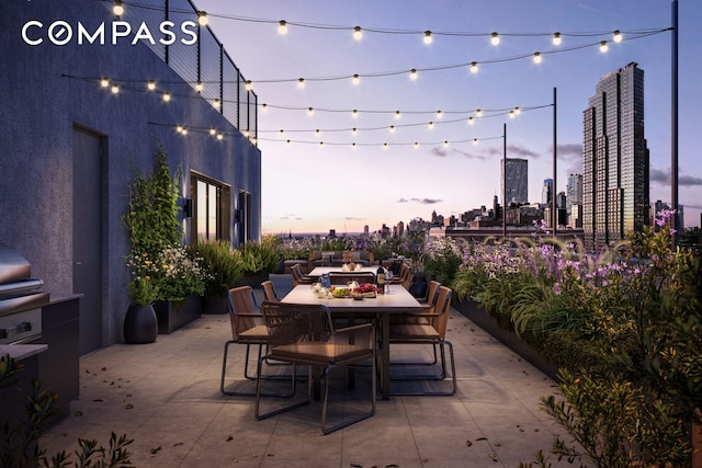 view of patio / terrace with outdoor dining area and a view of skyline
