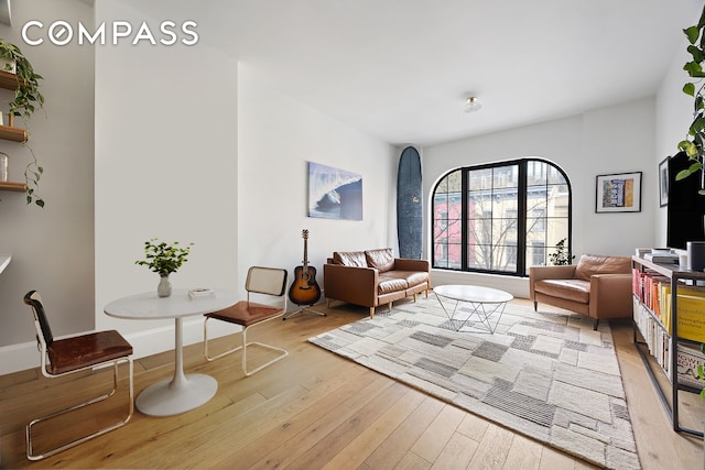 living room with light wood-style floors and baseboards