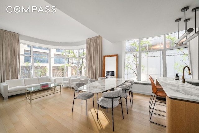 dining room featuring light hardwood / wood-style floors and sink