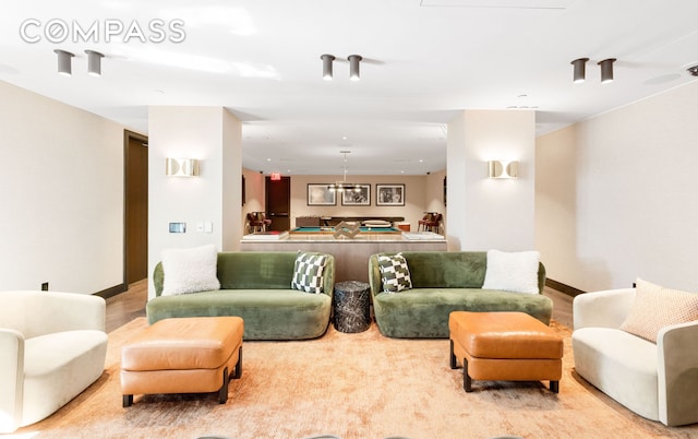 515 W 18th St Unit 210, New York City, NY 10011 - living area featuring wood finished floors and baseboards