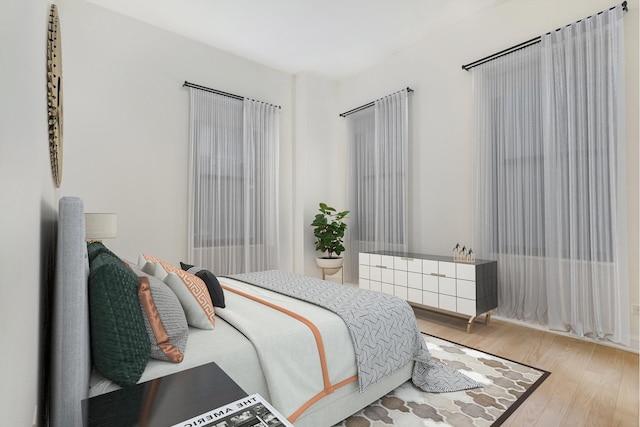 bedroom featuring wood finished floors